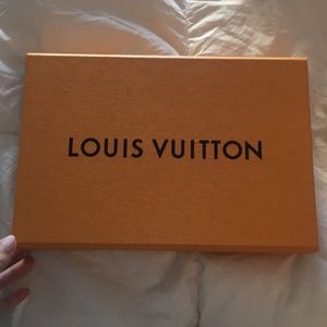 Empty Louis Vuitton box and blue ribbon